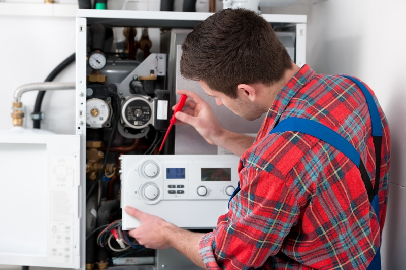 Gas Safe engineer working on a boiler in South Kensington